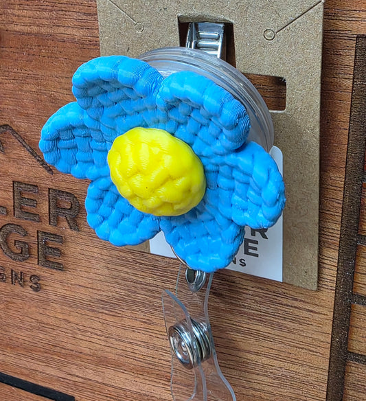 Blue daisy badge reel