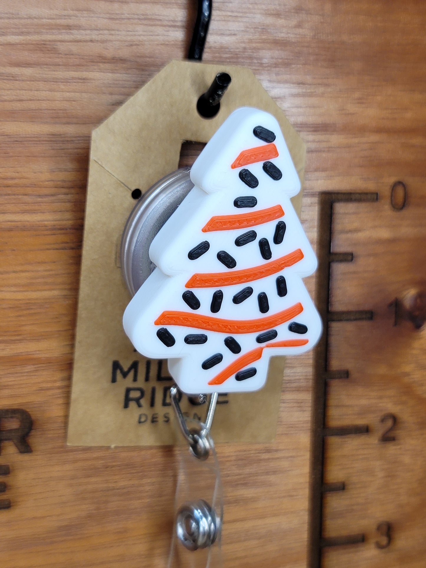 Christmas tree treat badge reel (black sprinkles)
