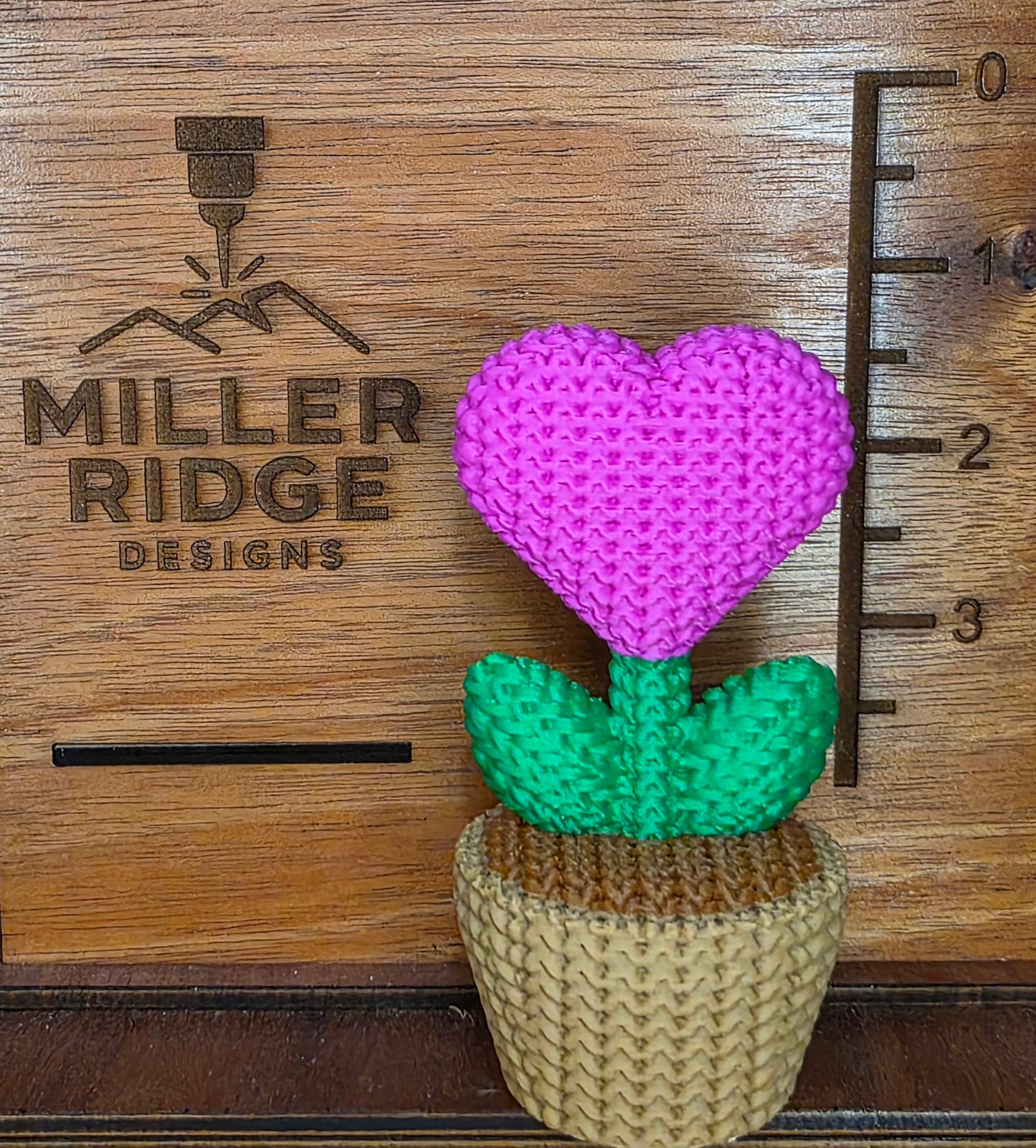 Knitted pink heart flower pot