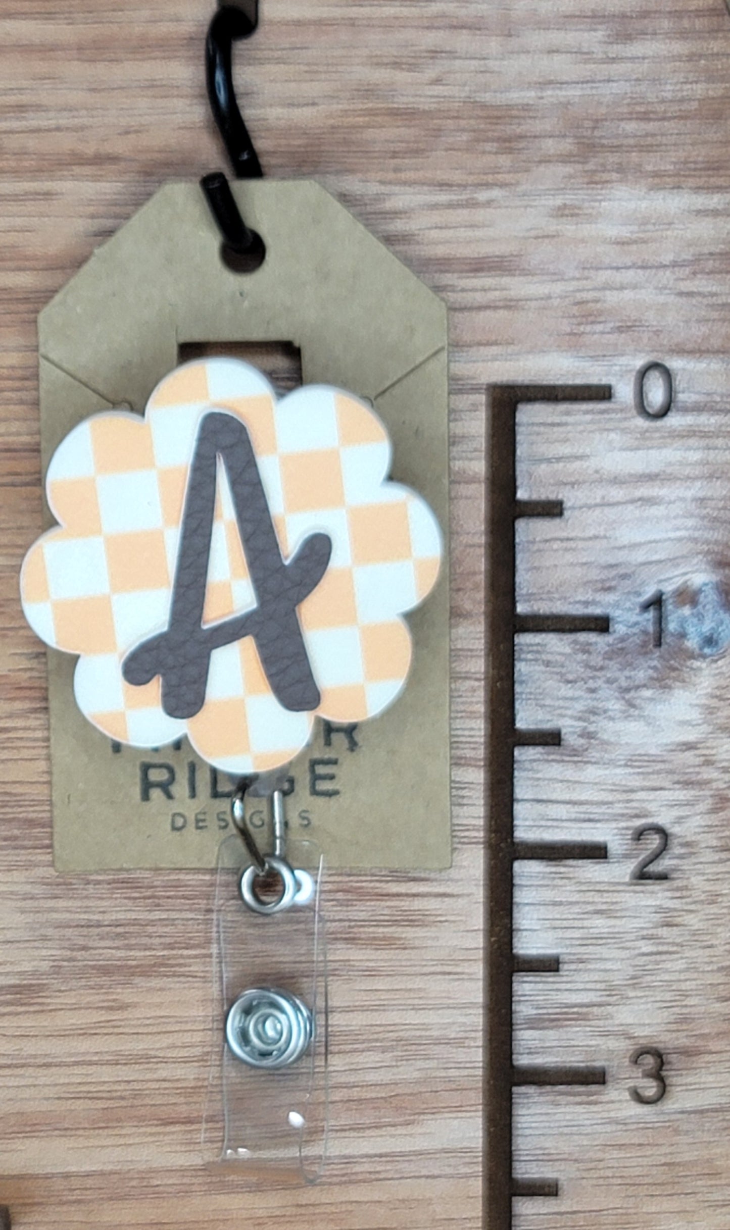 Checkerboard with initial badge reel