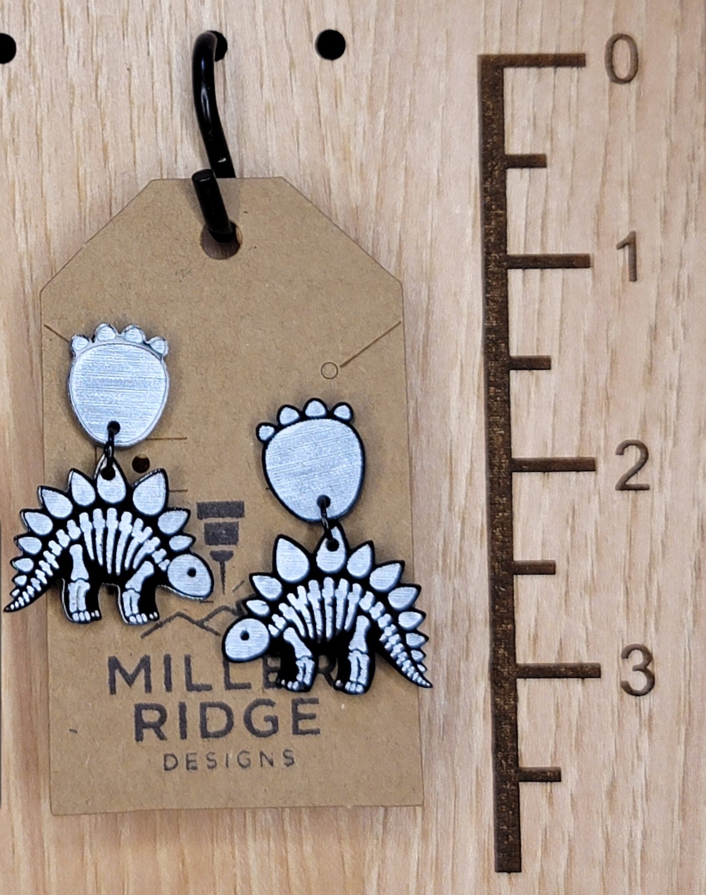 Skeleton dino with paw dangles