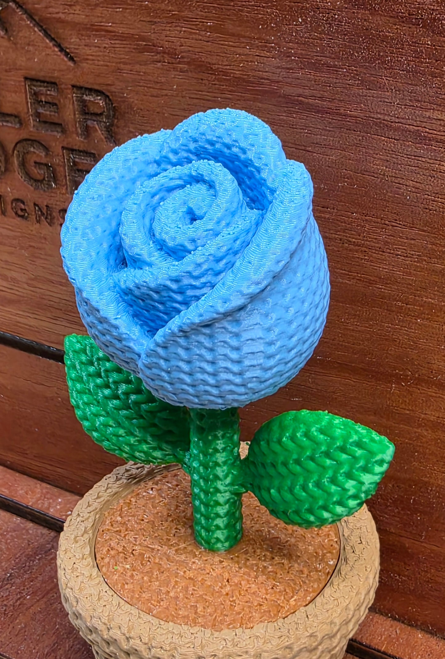 Knitted blue rose flower pot