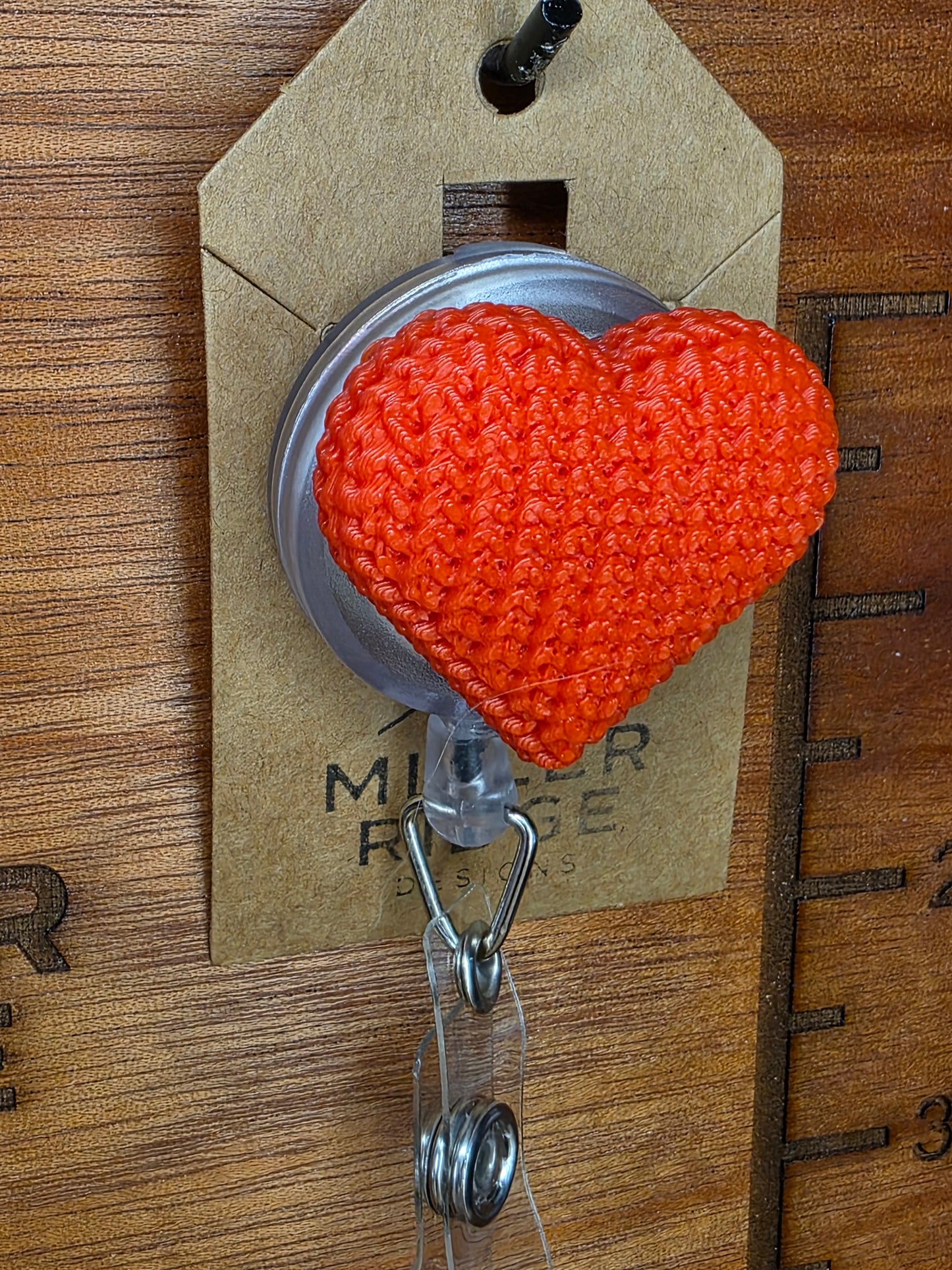 Red knitted heart badge reel