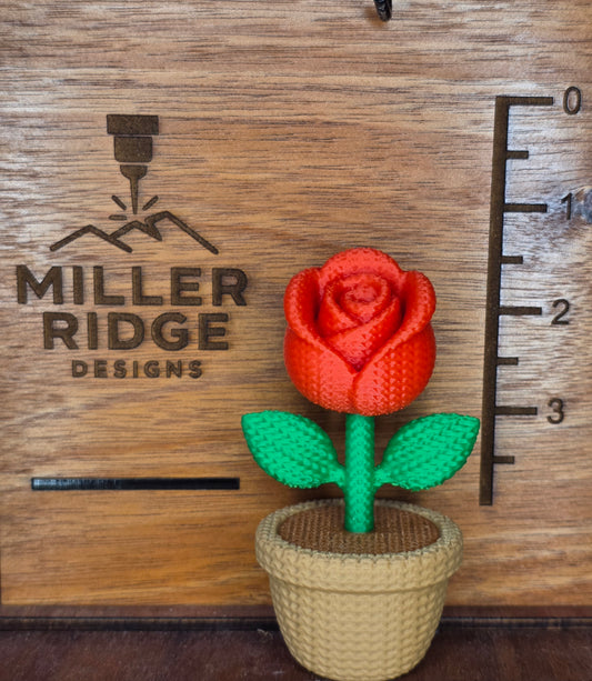 Knitted red rose flower pot