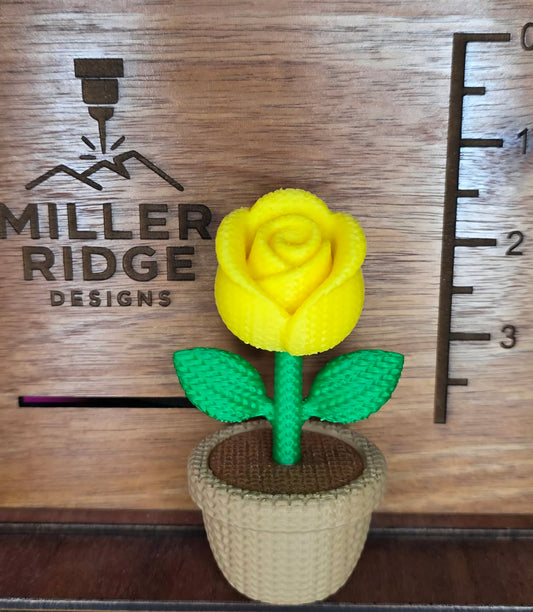 Knitted yellow rose flower pot