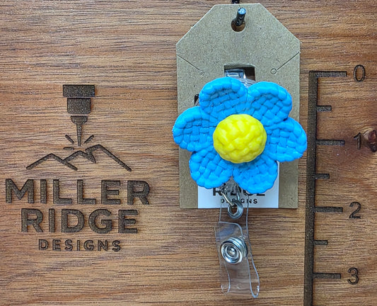 Blue daisy badge reel