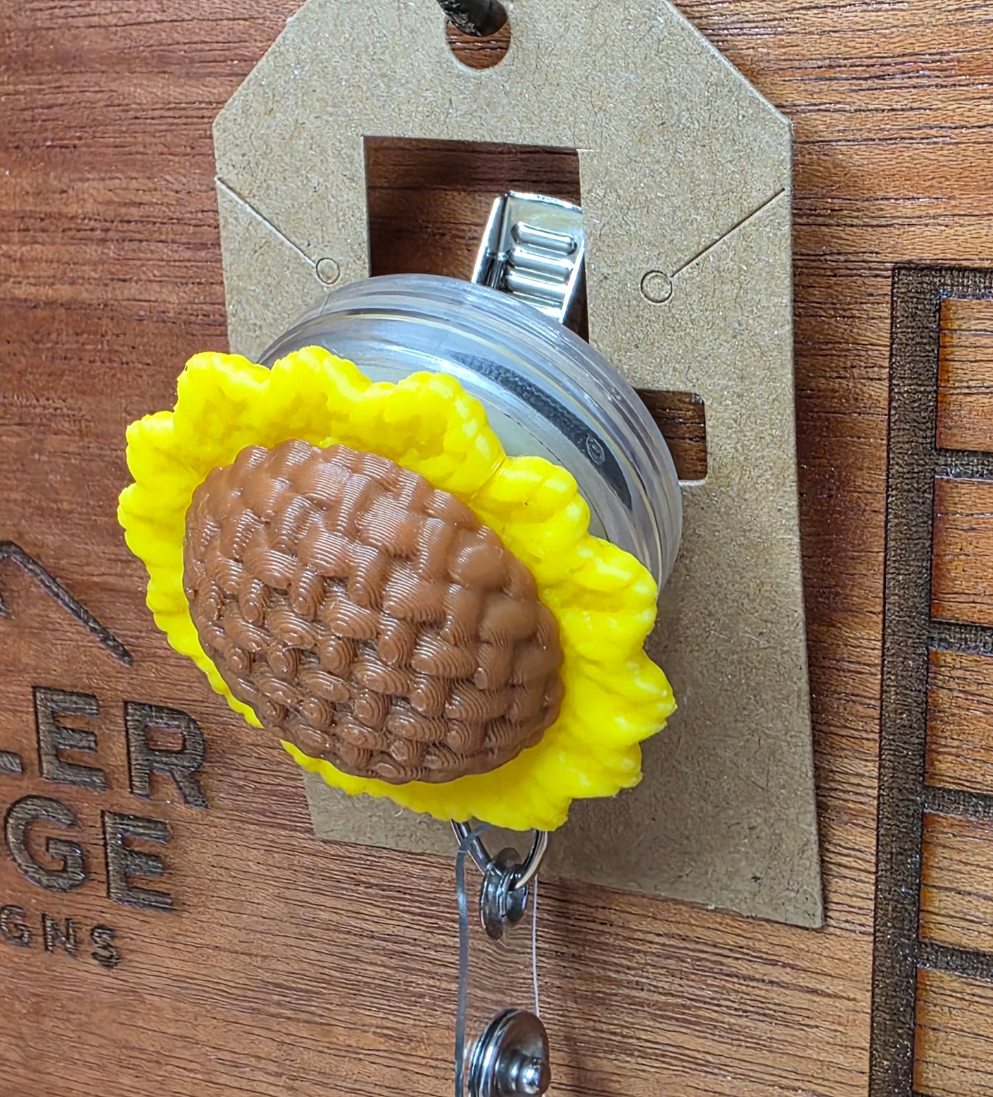 Sunflower badge reel