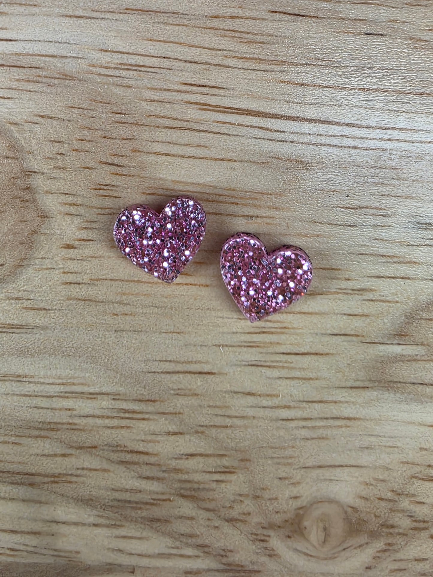 Pink glitter heart studs