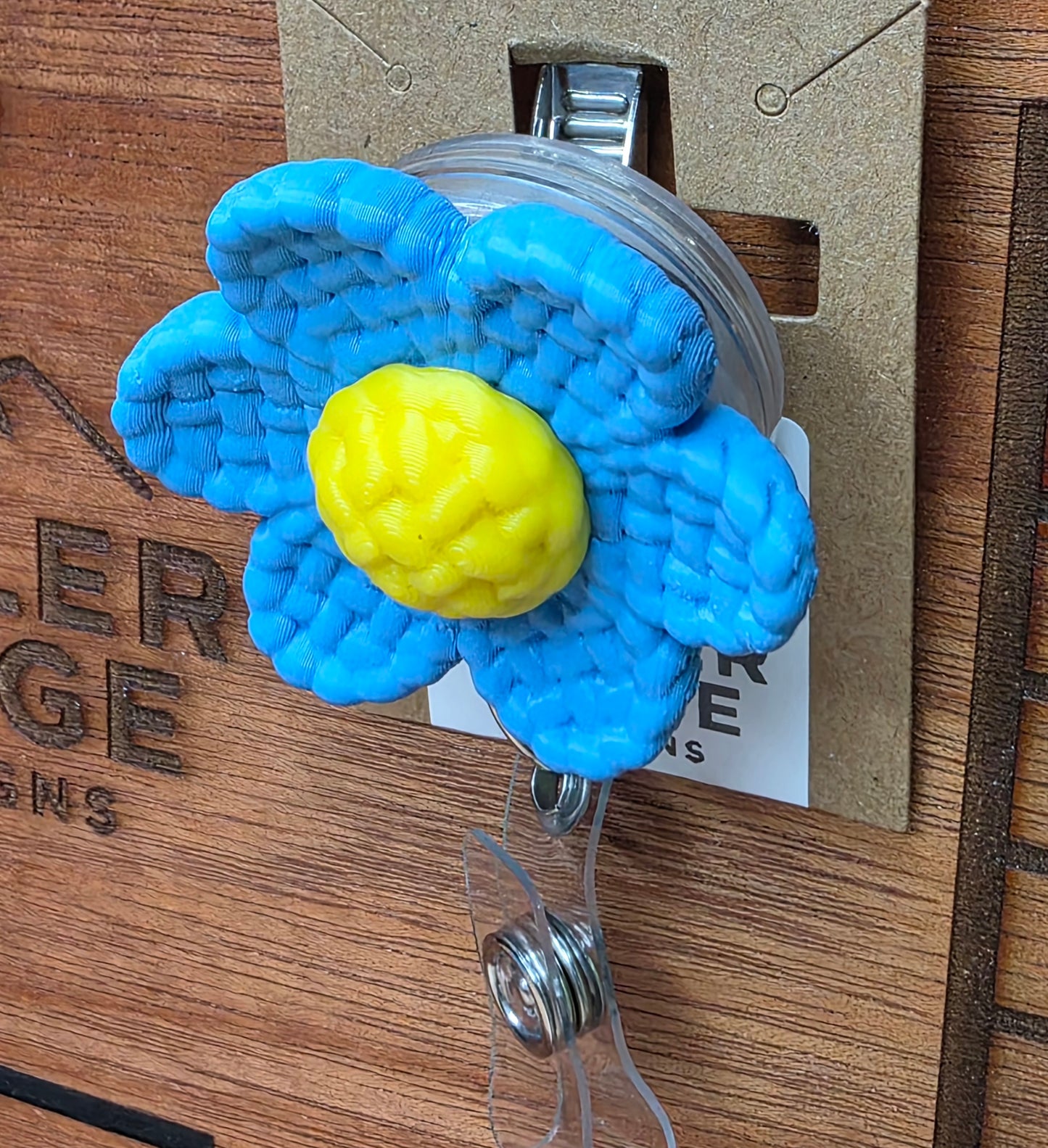 Blue daisy badge reel