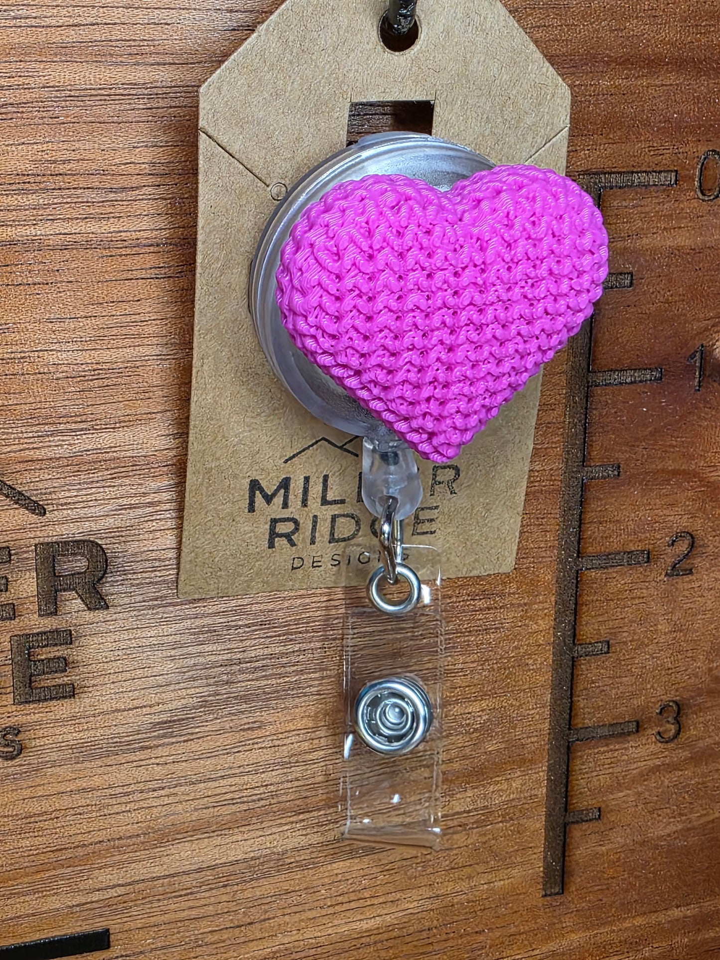Pink knitted heart badge reel