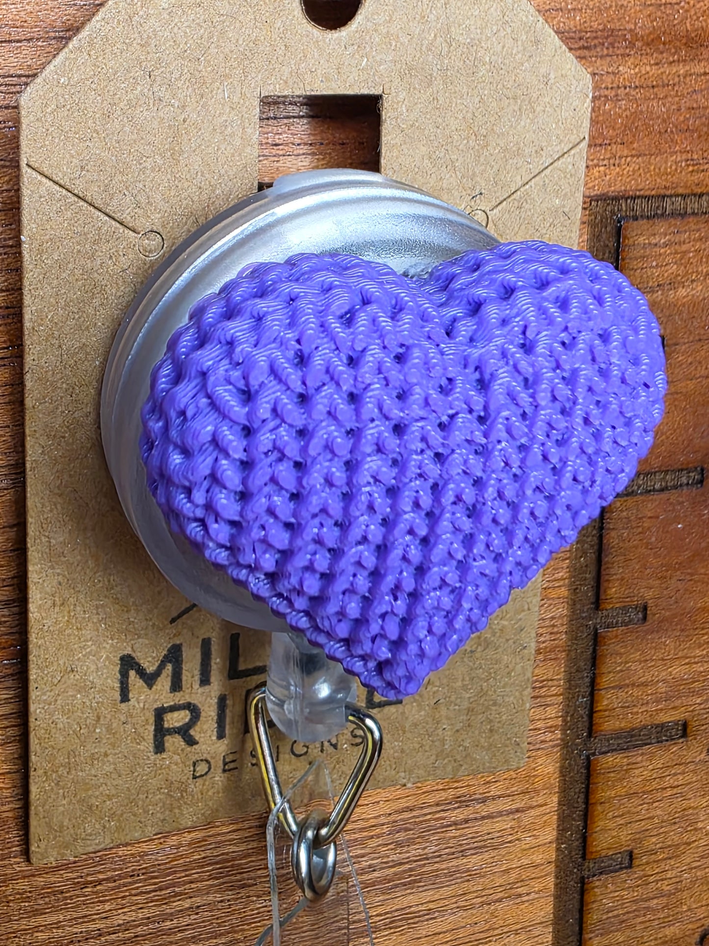 Purple knitted heart badge reel