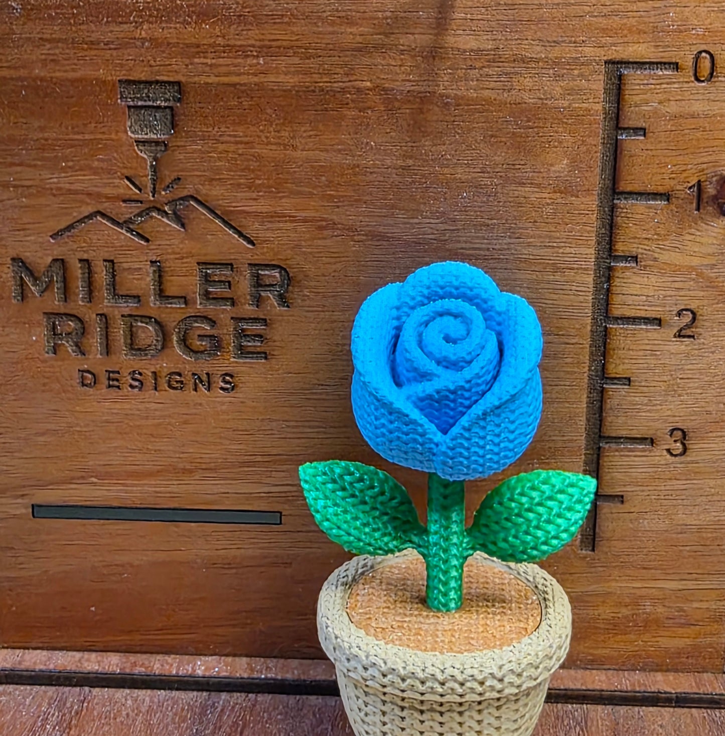 Knitted blue rose flower pot
