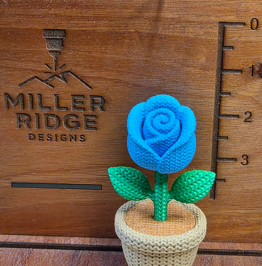 Knitted blue rose flower pot