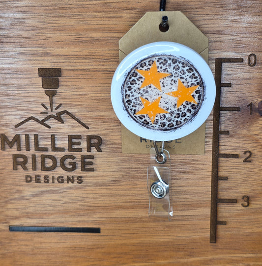 Tristar and animal print badge reel