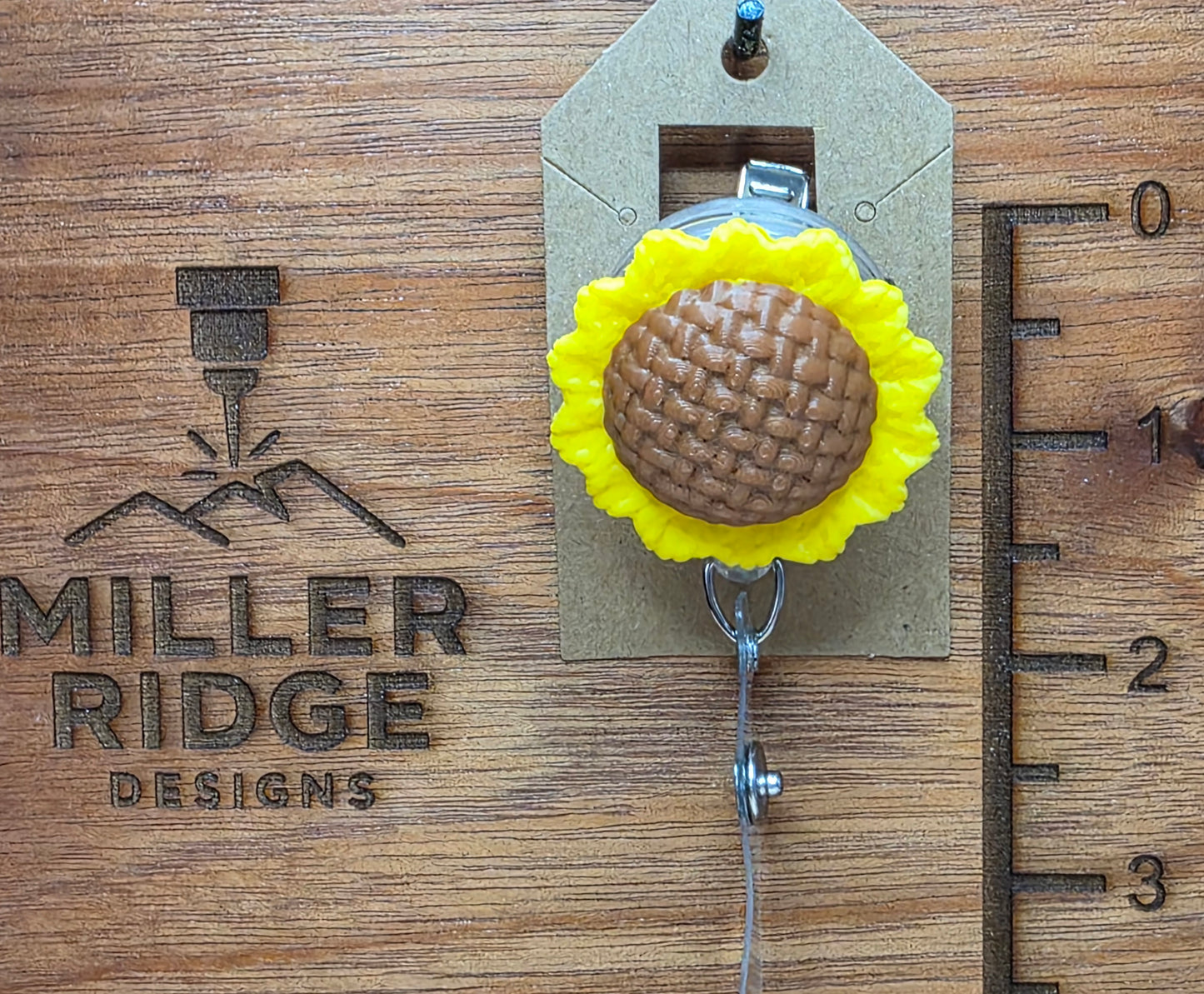 Sunflower badge reel