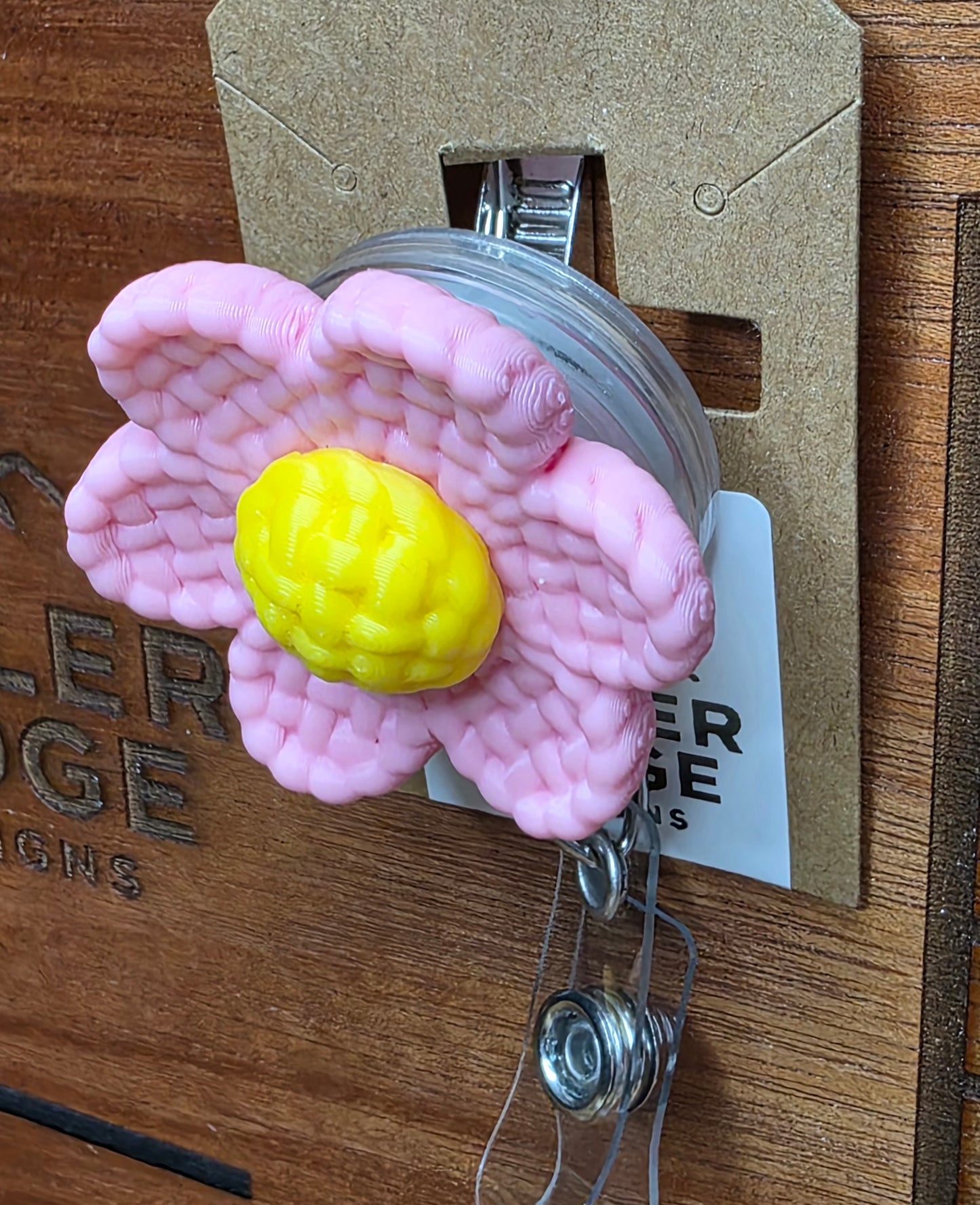 Pink daisy badge reel