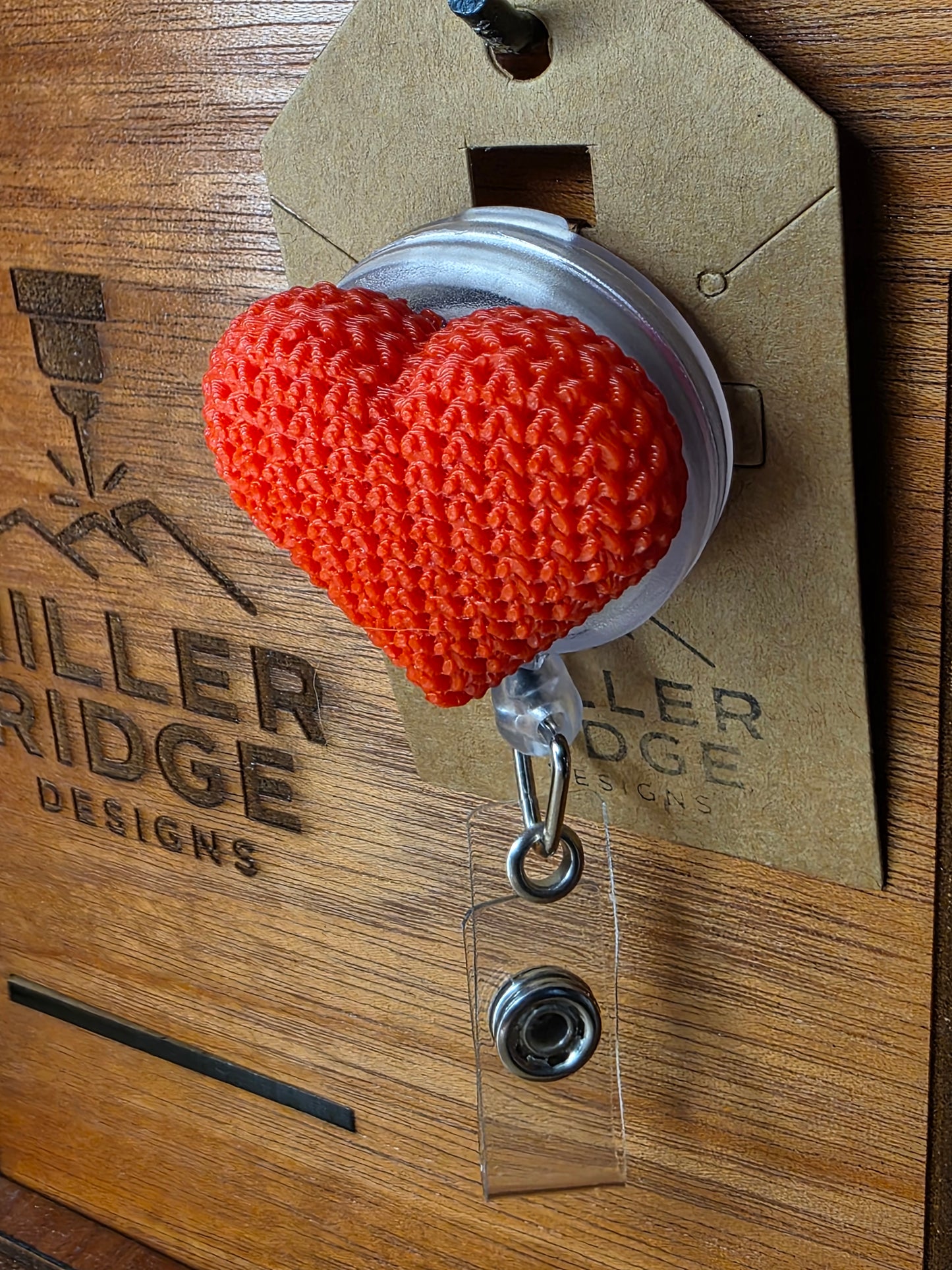 Red knitted heart badge reel