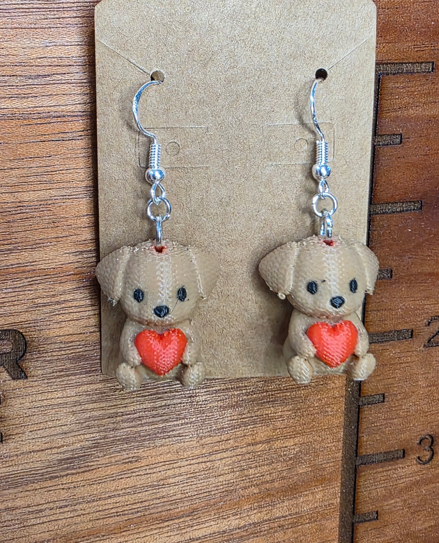 Knitted dog holding heart