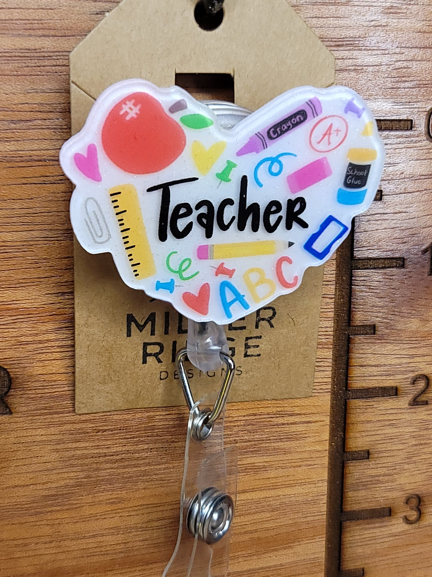 Teacher badge reel